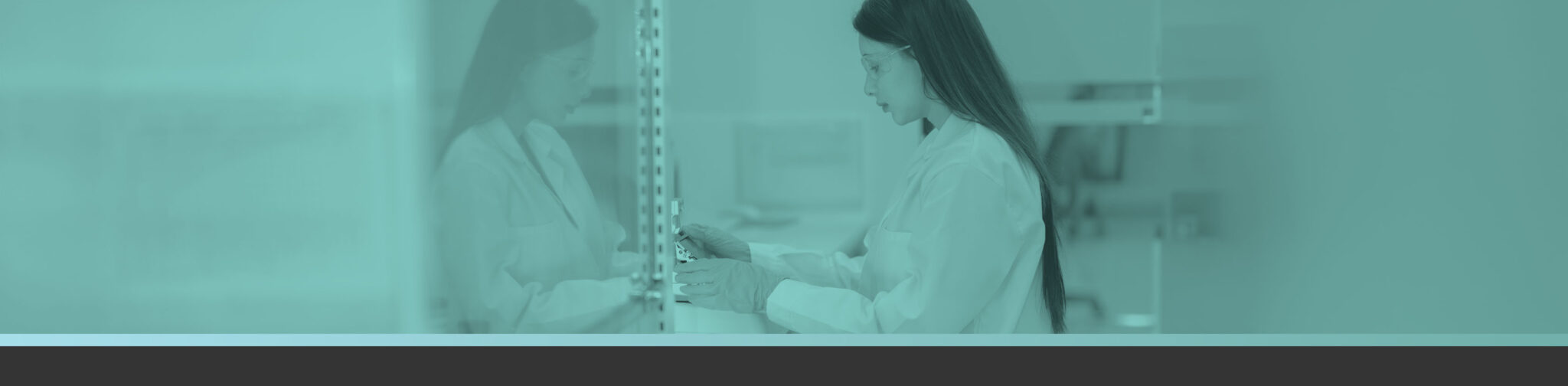 scientist in lab coat bioprocessing lab using bioprocessing tools that enable more flexible and efficient drug development workflows